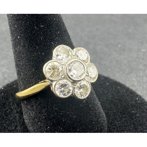 540 - Jewellery: Jewellery: 18ct gold floral cluster ring, rub over set with seven brilliant-cut diamonds,... 