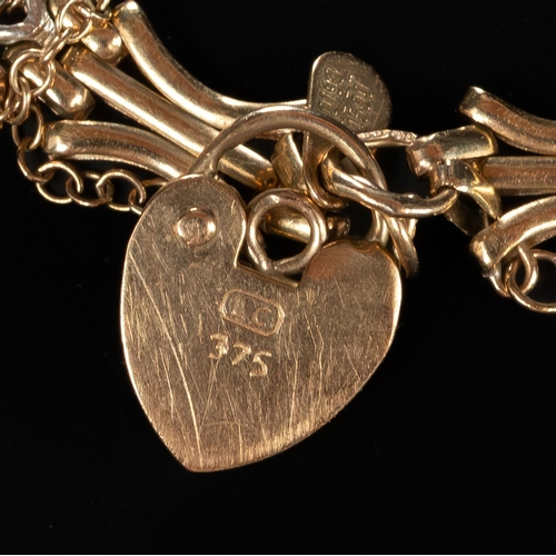 551 - Jewellery: a 9ct gold open fancy link two colour bracelet with heart shaped clasp, broken. 20.5cm, 8... 