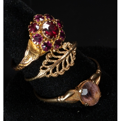 558 - Jewellery: a 9ct gold and garnet cluster ring, UK size O; a 9ct gold and amethyst solitaire ring, UK... 