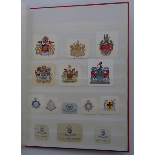 103 - A stockbook of cut out Crests from late Nineteenth and early Twentieth Century (hundreds)