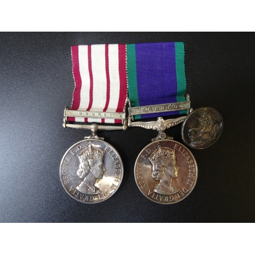 129 - A Navy General Service medal (QEII) with Brunei clasp and General Service medal (QEII) with Borneo c... 