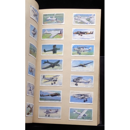 60 - An album of sets and part sets of trade and cigarette cards in good condition including Boxing Perso... 