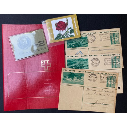 264 - A small accumulation of Swiss stamps and postal history, including year books from the 1980s & 1990s... 