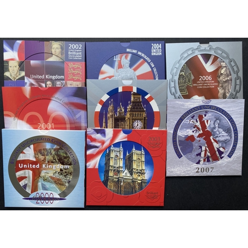 77 - A collection of UK Brilliant Uncirculated Year Coin Sets in R.M. presentation folders from 1983 to 2... 