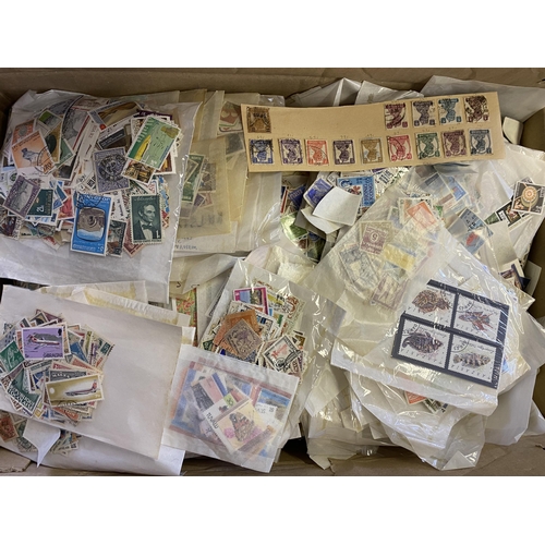 135 - A mainly used World stamp accumulation on pages but mainly 1000s of packets, all periods, strength i... 