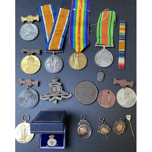 131 - A group of UK war medals including WWI pair War Medal and Victory to 1710. GNR.E.MAY. R. A. plus cap... 