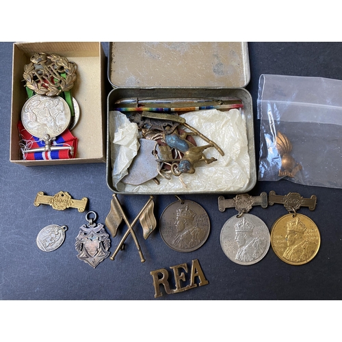 131 - A group of UK war medals including WWI pair War Medal and Victory to 1710. GNR.E.MAY. R. A. plus cap... 