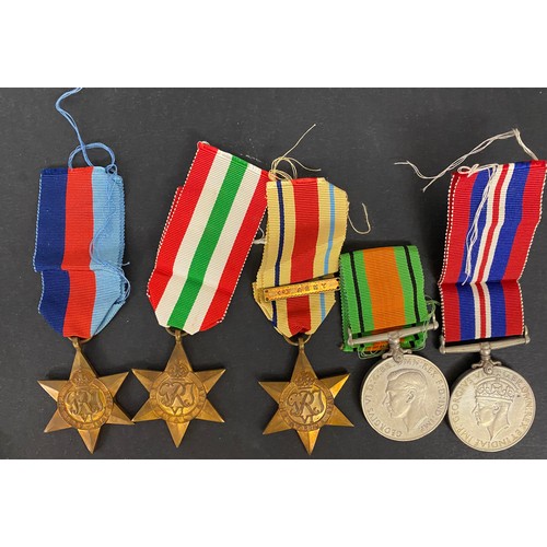 127 - A duplicated accumulation of nine UK WWII medals, including The Italy Star, Africa Star and 1939-45 ... 