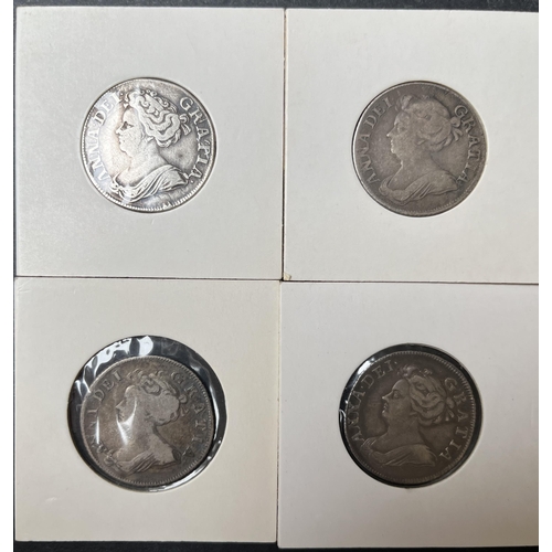 102 - A group of four UK Queen Anne Shillings, including 1705/1708/1711 coins, in poor to fine condition