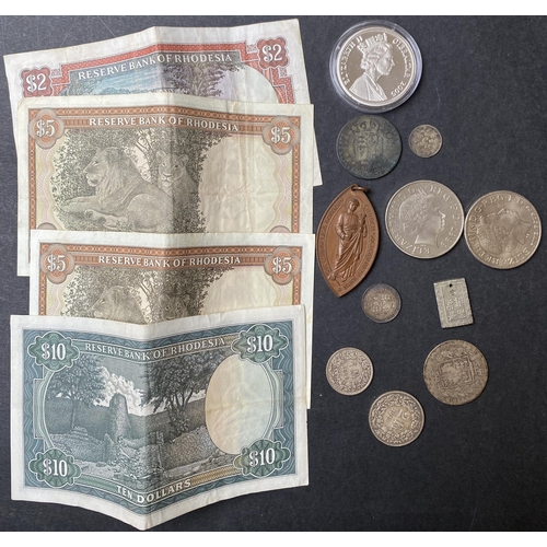 50 - A small accumulation of World coins and banknotes many assorted into bags, mainly circulated 20th ce... 