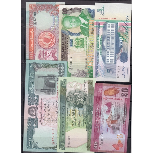 113 - An accumulation of 100 World 20th Century uncirculated banknotes, including notes from Kenya, Solomo... 