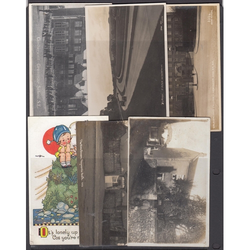 445 - A World postcard in six volumes and loose, mainly early mid-20th Century cards, including many Real ... 