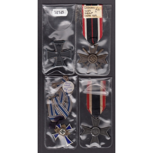 161 - A group of 10 German WWI & WWII medals, including x3 Iron Crosses, Cross of Honour, War Merit Cross ... 