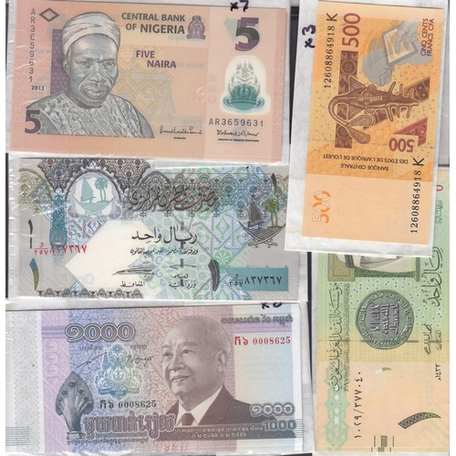 97 - A collection of 56 mint uncirculated banknotes from 11 Countries including India, Indonesia, Mauriti... 