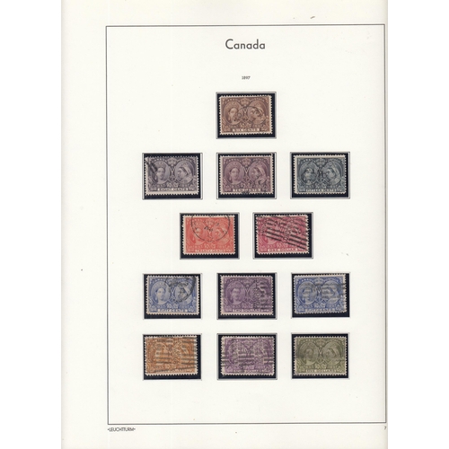 325 - A comprehensive mint & used collection of Canadian stamps housed in 2x illustrated Lighthouse volume... 