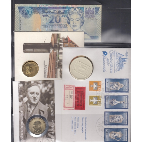 46 - An accumulation of 20th Century coin covers and banknotes, including various Germany and East German... 