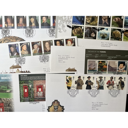 340 - A collection of GB FDCs and presentation packs housed in 11 volumes looking substantially complete c... 