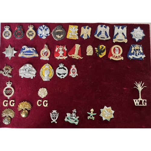 284 - A collection of x120 British Military Cap Badges including Bakelite and Staybrite examples, noted We... 