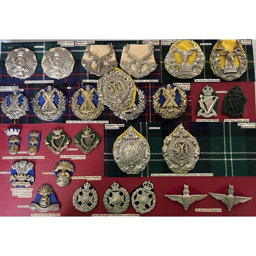 285 - A collection of x57 British Military Cap Badges including Bakelite and Staybrite examples, noted 21s... 