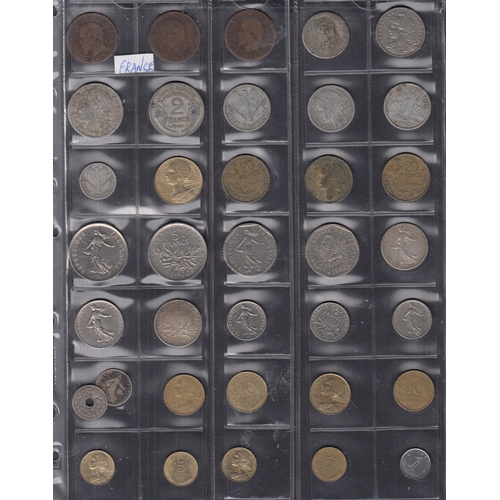 165 - A World coin accumulation in pages and loose, including various post 1947 circulated coins, UK moder... 
