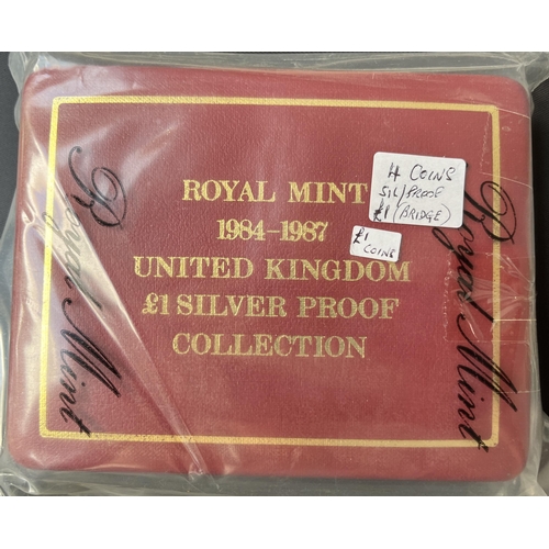 182 - A collection of x3 UK RM boxed silver sets, including 1984-1987 £1 silver proof set, 2004-2007 £1 si... 