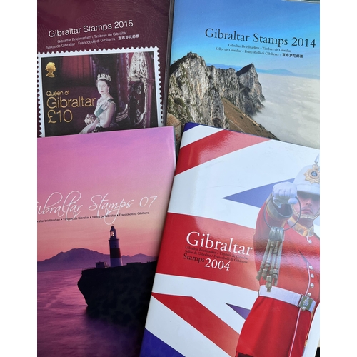 289 - A collection of Gibraltar mint stamps housed in 3x hingeless Davo albums bearing pages for issues 18... 