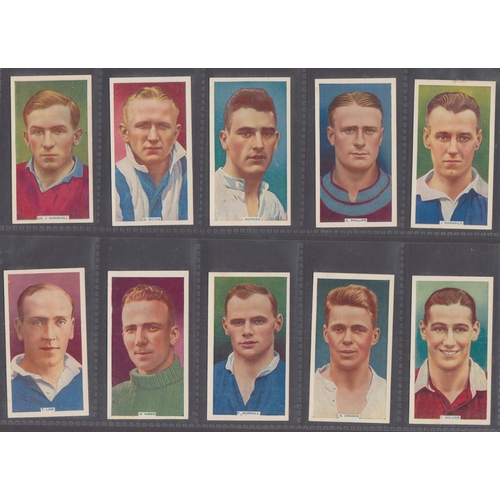 502 - A two-volume collection of mainly Football themed Cigarette cards, including 1934 Carreras Footballe... 