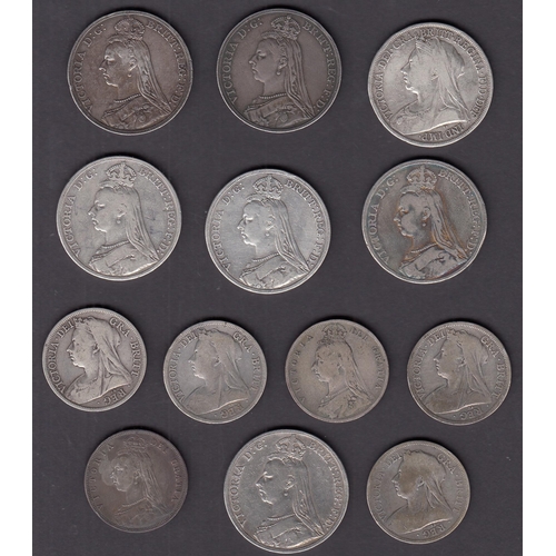 136 - A collection of x7 silver QV Crowns and x6 silver Half crowns, mixed condition