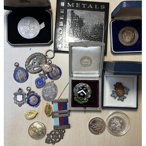 62 - A small group of x19 silver badges and medallions, including some School Achievement badges.