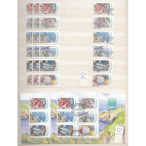 333 - An ex-dealers duplicated mint and used Guernsey stamp stock in x7 volumes, from 1941 to 2012, includ... 