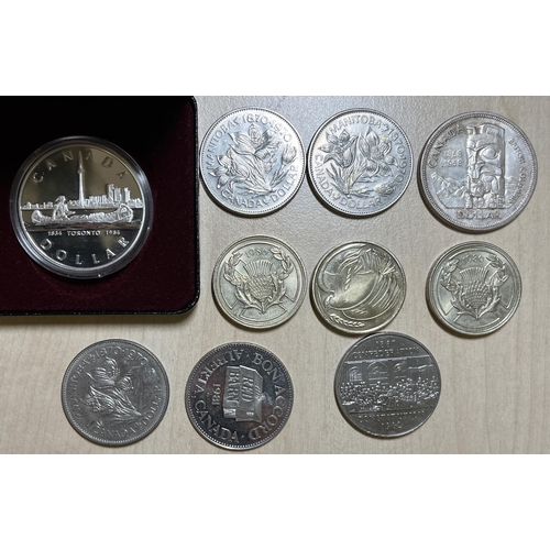 12 - A small accumulation of World coins, mainly UK QEII Crowns, noted Canada x6 $1 including 1984 silver... 