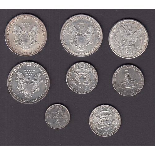 164 - A group of x8 USA mainly silver coins, including x4 silver $1 1884/ 1988/ 2000x2 coins, good conditi... 