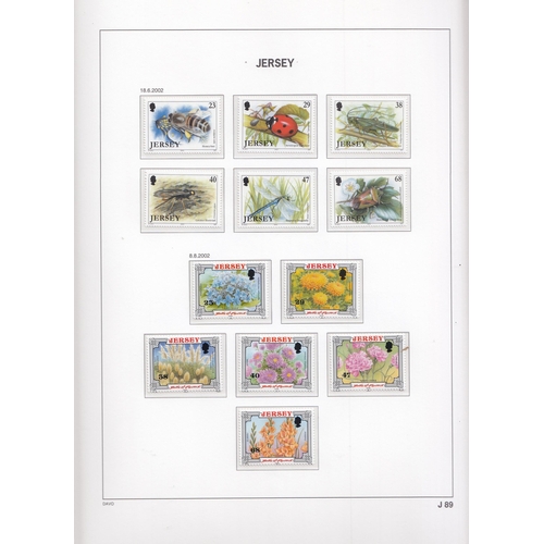 266 - A mint and used Jersey stamp collection in x4 Davo Lux albums and loose from 1969 to 2002 including ... 