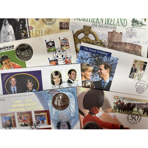 108 - A collection of x560+ modern World coin covers in various albums, including Commemorative covers for... 