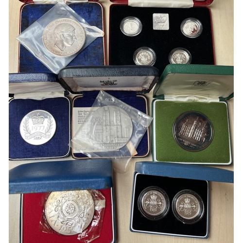 43 - A group of x7 silver boxed coins/sets, including UK RM 1984-1987 silver proof x4 £1 set, 900th Anniv... 