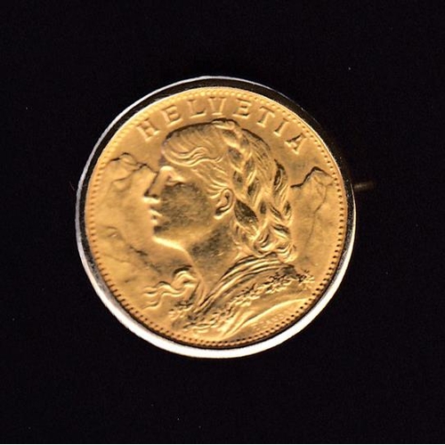 12 - Switzerland 1897 gold 20Fr coin, inset in gold broach, in good condition