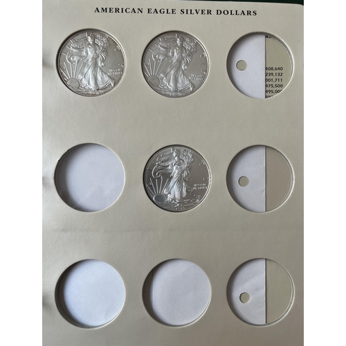 23 - A collection of x28 USA uncirculated silver $1 coins from 1986 to 2015 housed in a Littleton album i... 