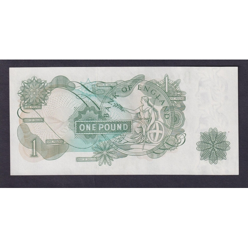 192 - UK 1970 Page £1 banknote showing major error of over inking of green through middle of bank note, in... 