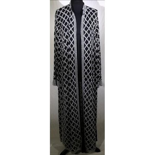 62 - White beads hand embroidered on black background. High neck, sheer long sleeves, relaxed fit jacket.... 