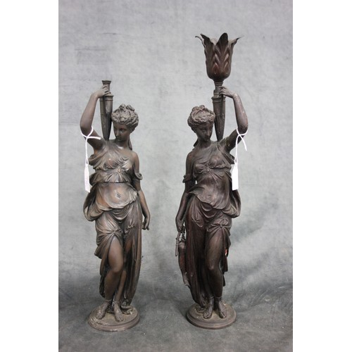 171 - Two spelter figures of ladies as water carriers, each 37cm and 43cm high, respectively.