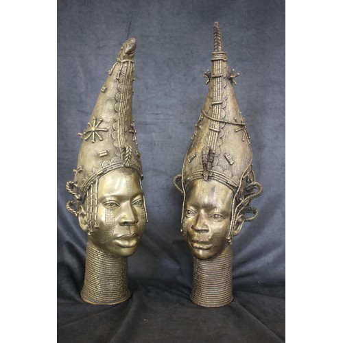 54 - Two Benin gilt bronze busts, heads of Ife Queens, each 63cm and 67cm high, respectively.