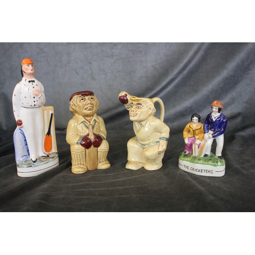 59 - Two H.J. Wood toby type jugs, Bowler and Batsman, each 18cm high, a Staffordshire pottery group 