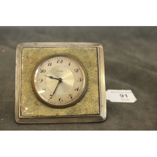 91 - A small silver and shagreen cased travelling time-piece Birmingham 1899, on brass stand.