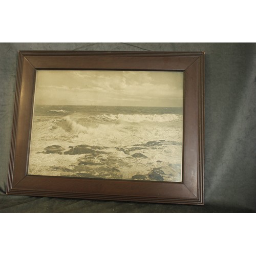 149 - An early 20th century oak hanging shelf, with six framed photographs of Roman amphitheatre and ruins... 