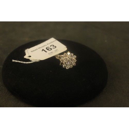 163 - A 9ct gold zircon cluster dress ring, one stone missing.