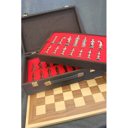 300 - A modern alloy chess set, possibly by Kaoori, figures in medieval style, in box, together with a mah... 