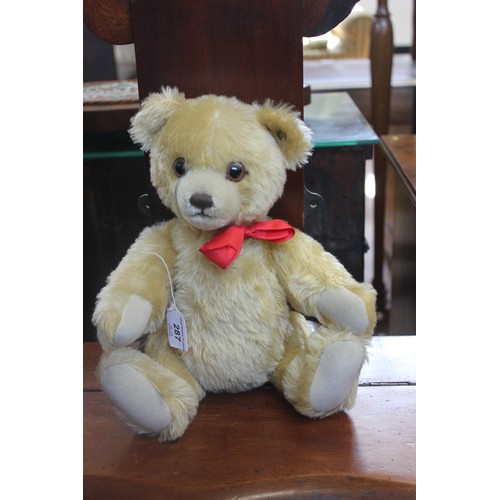 287 - A small Stieff pale plush teddy bear, with oxidised brass button, and growler, 32cm high.