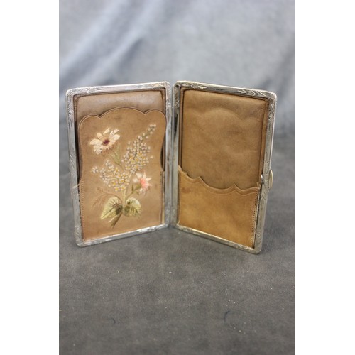 210 - A late Victorian leather and silver-plated card case, the part fitted interior decorated with silk f... 