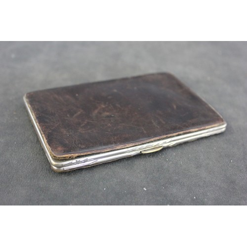 210 - A late Victorian leather and silver-plated card case, the part fitted interior decorated with silk f... 