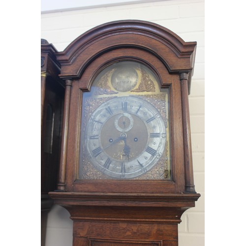 7 - A 19th century oak longcase clock, with arched hood, the trunk door with moulded edge, the eight-day... 